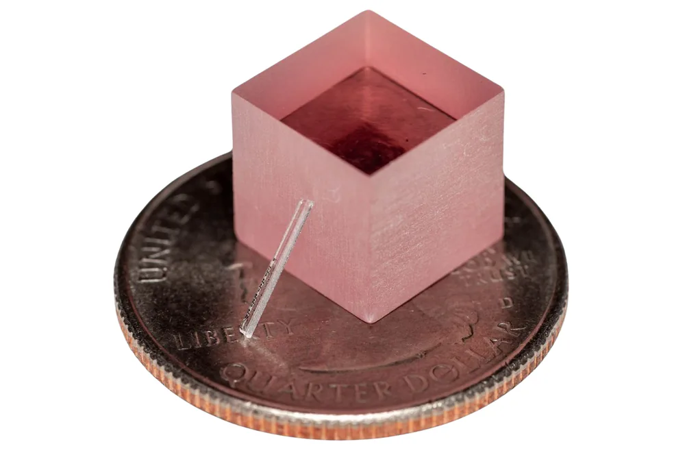 Titanium:Sapphire crystal cube on a US quarter